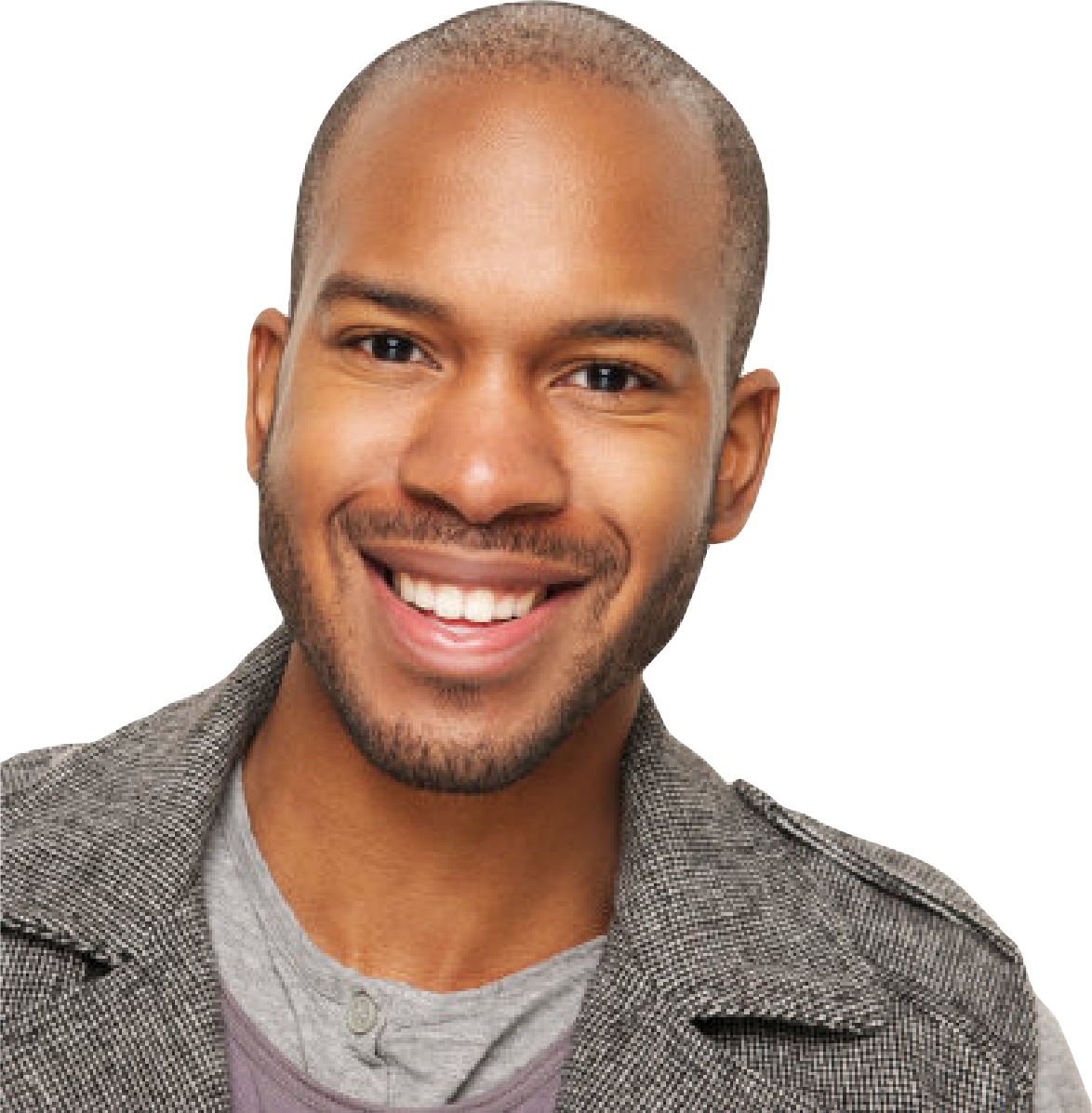 A young man with a bald head, a trimmed beard, and a wide smile is looking directly at the camera. He is wearing a gray textured jacket over a light gray shirt. The background is transparent.
